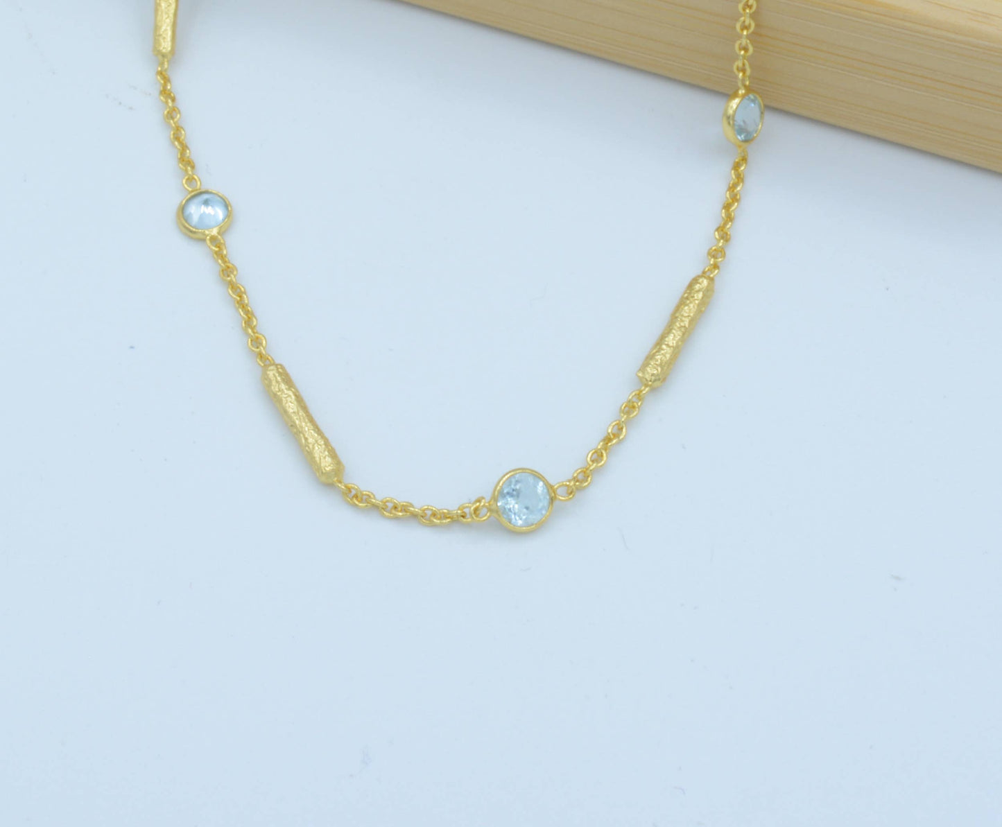 AJS Design Studio - Blue topaz necklace with textured tube spacers