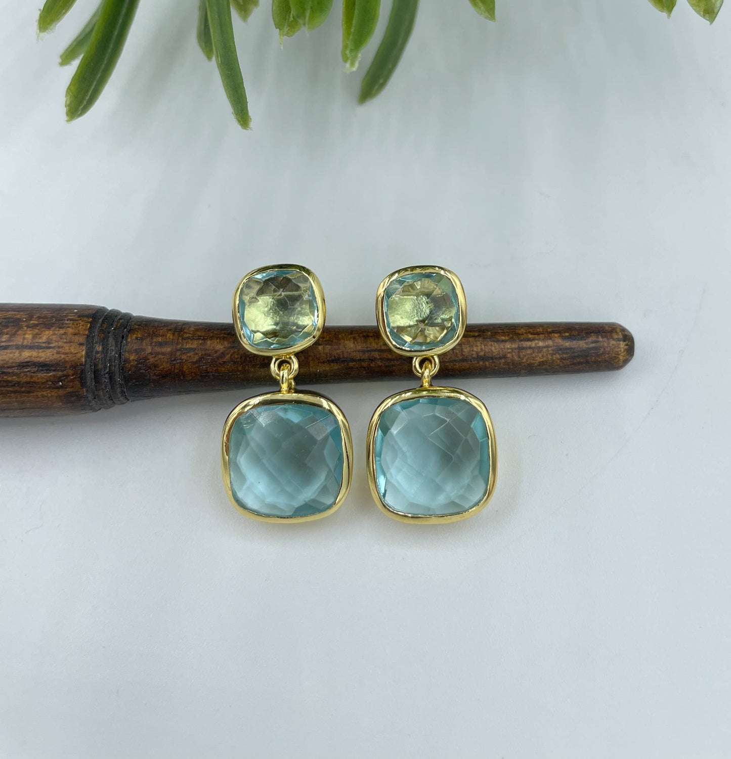 AJS Design Studio - Gold cushion cut double drop blue topaz earrings