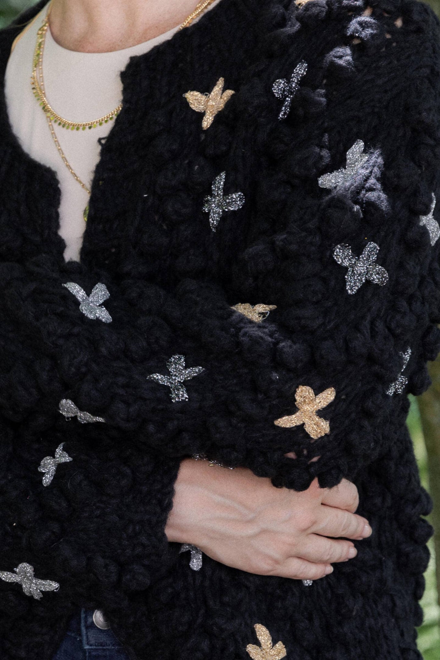 SAACHI - Knitted Cardigan Cross Pom Pom: IVORY