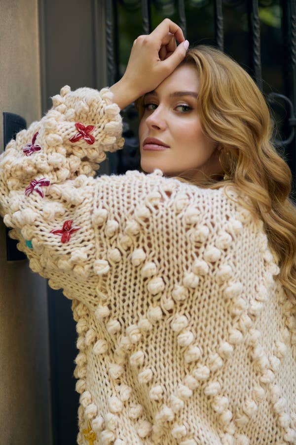 SAACHI - Knitted Cardigan Cross Pom Pom: IVORY