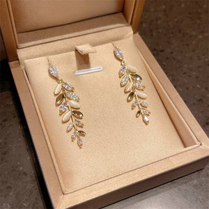 PEACH ACCESSORIES - EUR420 Crystals leaves long earrings in Ivory